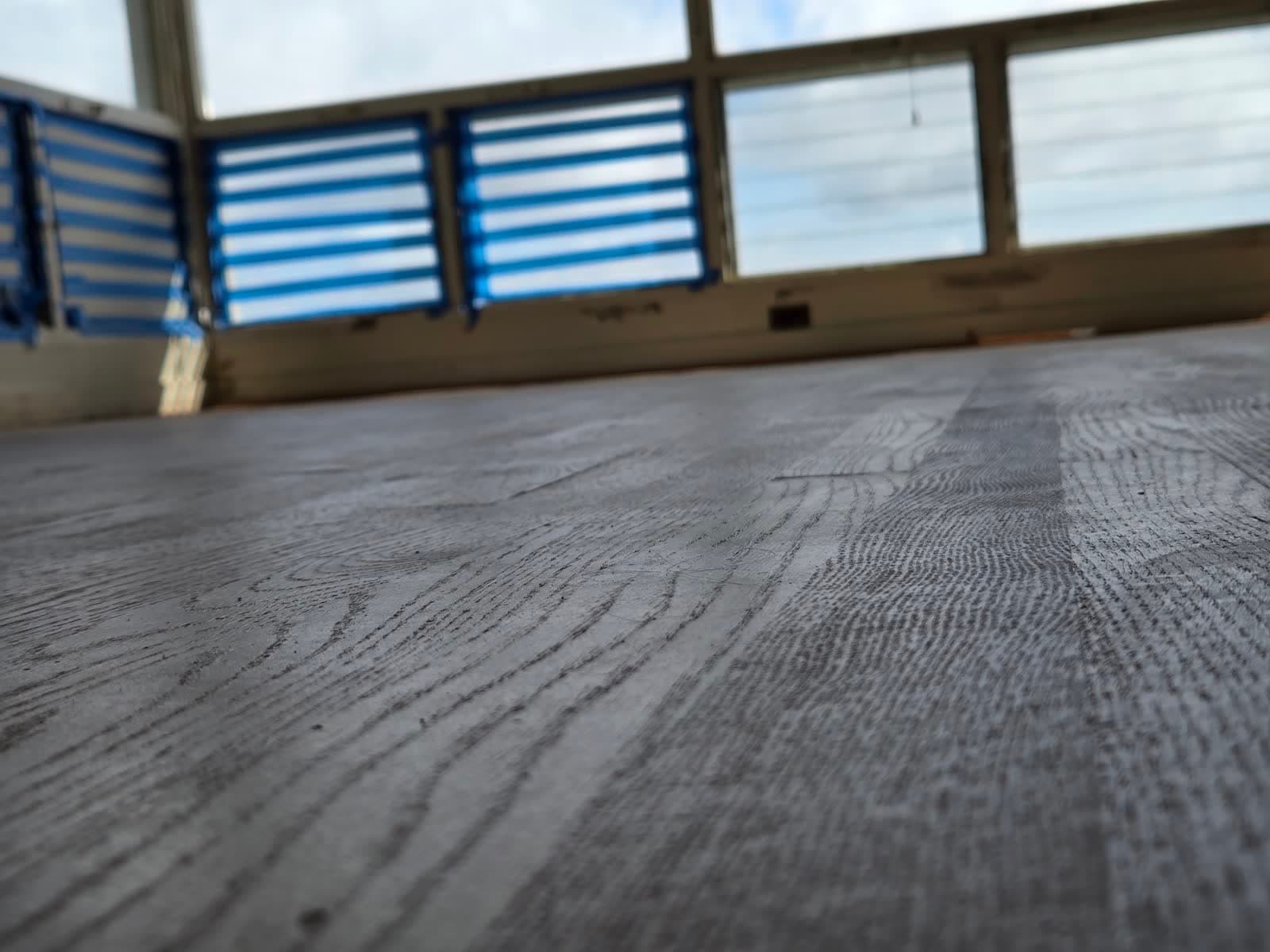 Sep 22: low sun across the floor shows mill marks on every board.